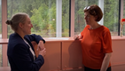 Henrietta Carbonel and Monica Ward conversing